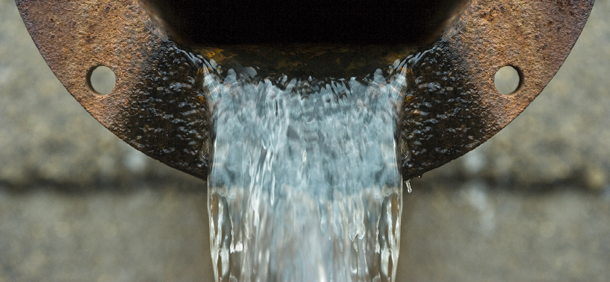 Effluent pouring out of sewer