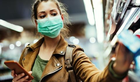 Woman wearing non-surgical face mask grocery shopping