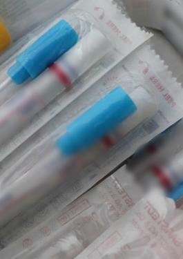 Microbiological Test swabs in packaging with orange, yellow, and blue caps