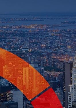 Arial view of NYC at night with part of a colorful semi-circle overlay