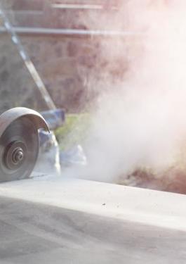 Person using concrete saw- creating respirable silica