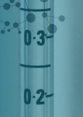 Close up of plastic syringes with gas molecules floating over them