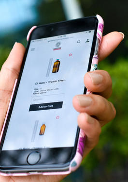 a cell phone with the ordering sampling supplies website on display