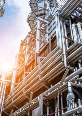 Industrial view at oil refinery with sun shining through