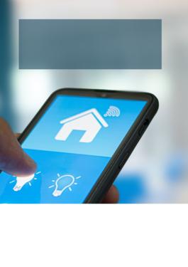 phone showing a smart home app with a finger pressing a 'lights' button