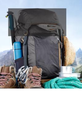 backpack with hiking gear on top of a mountain