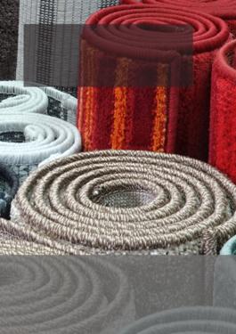 rolled up rugs of various colors