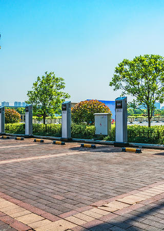 Electric Vehicle parking spots facing a river in a large city