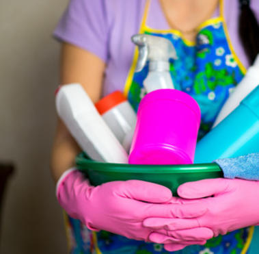 bucket full of household cleaning supplies